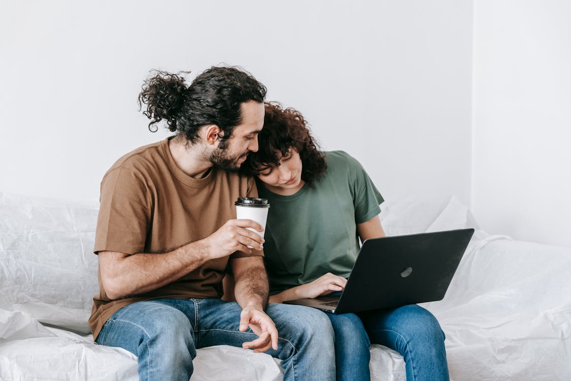 Free Couple  Relaxing On A Couch Stock Photo