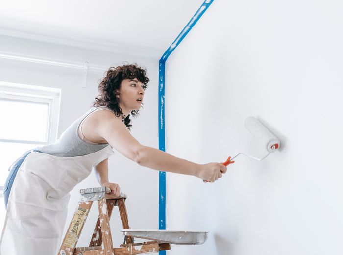 Painting a wall with a roller