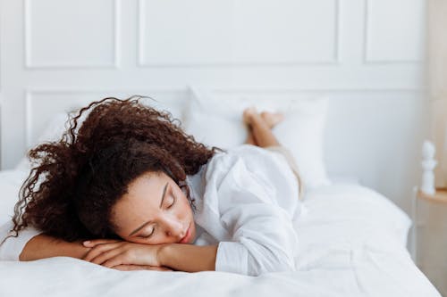 Free Photo of Woman Lying on Bed Stock Photo