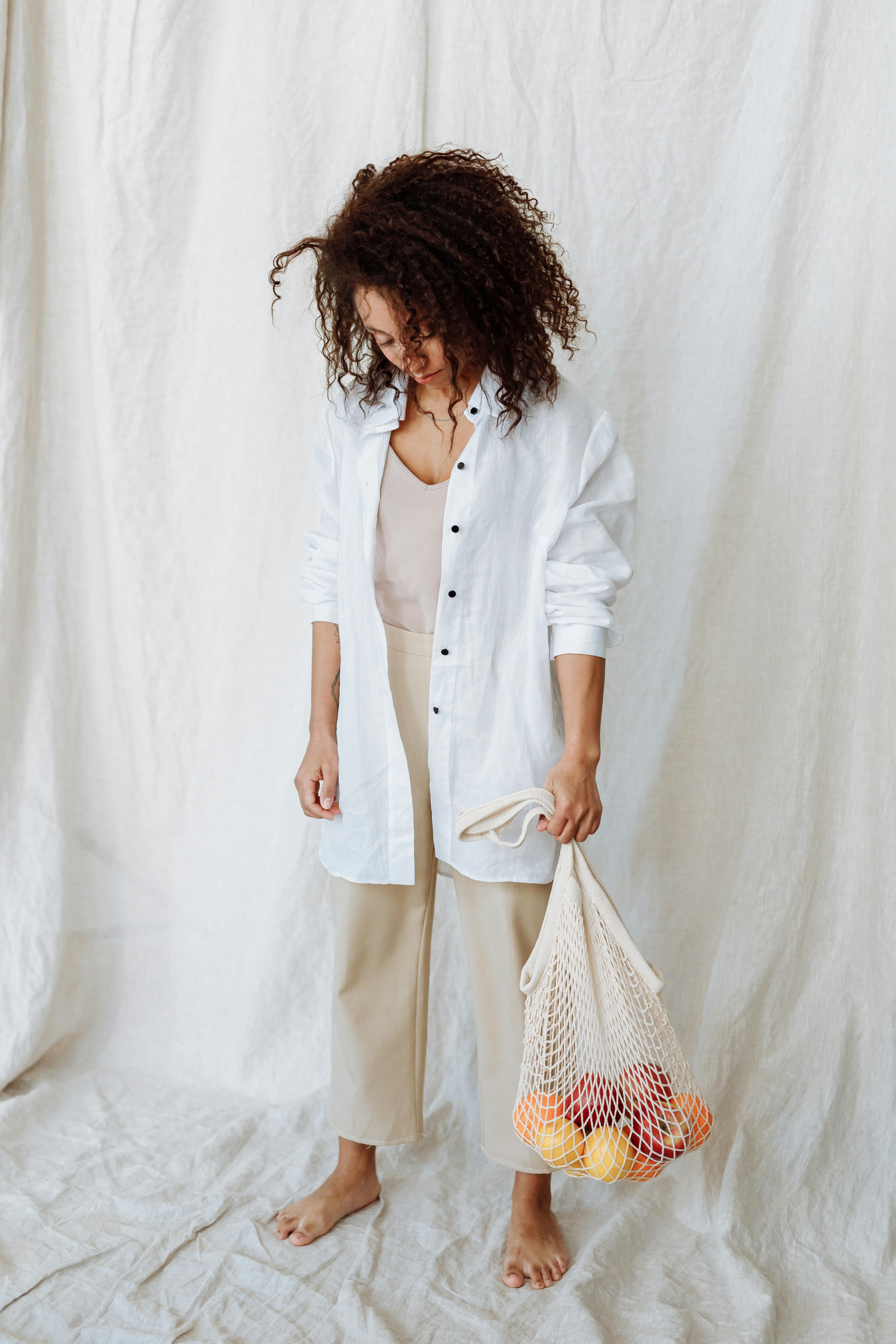 woman holding a net bag