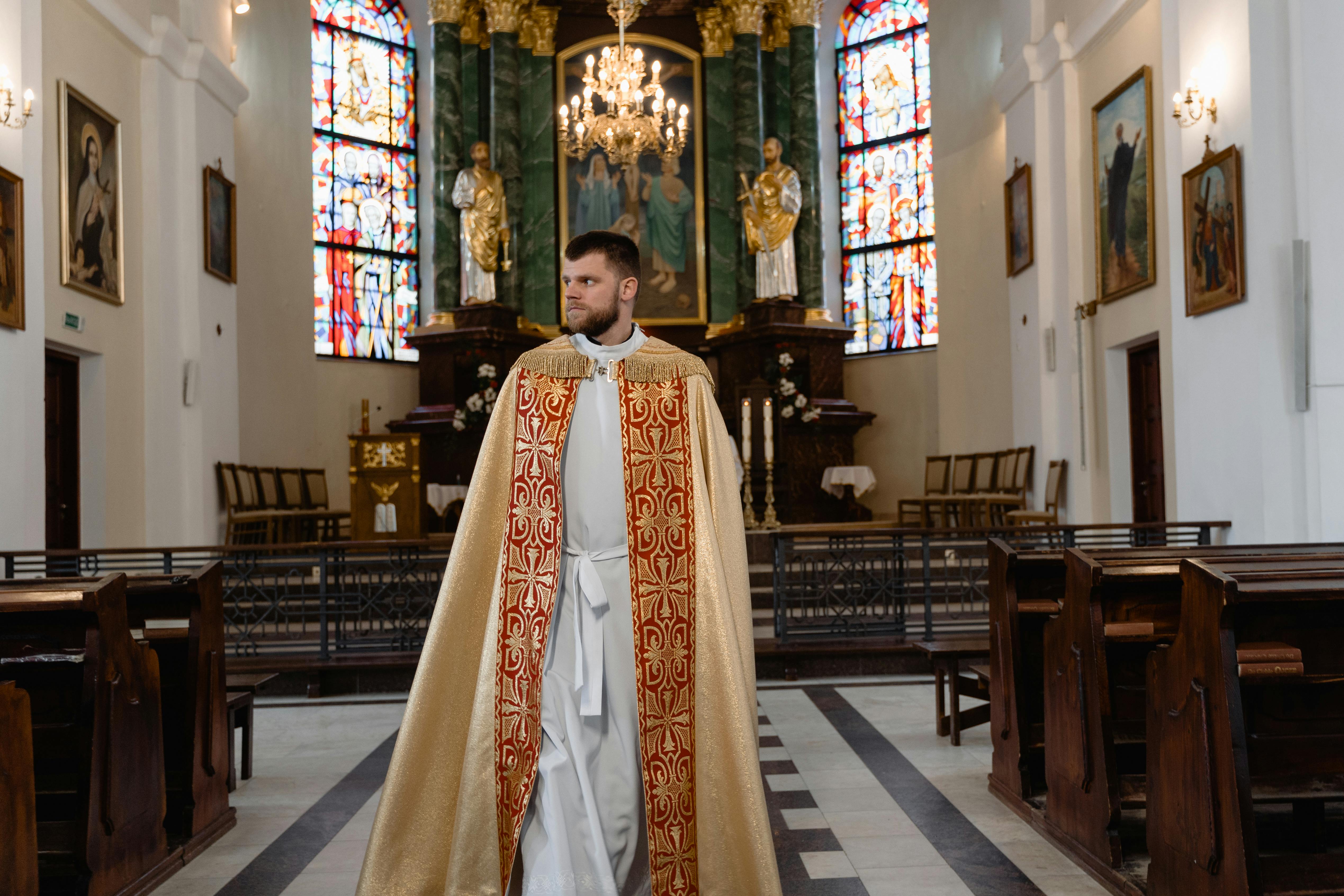 a priest in beige vestment