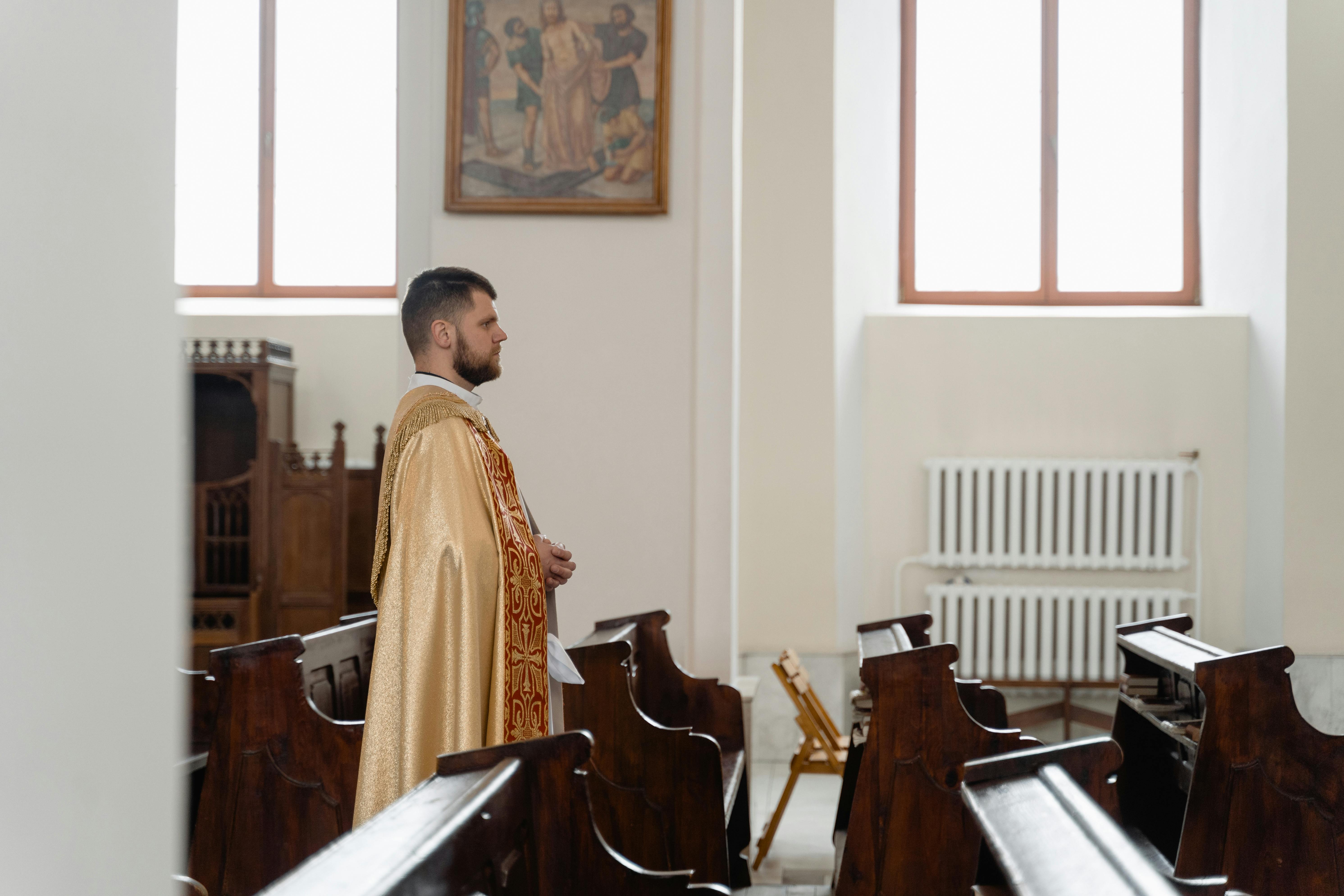 a priest in beige vestment