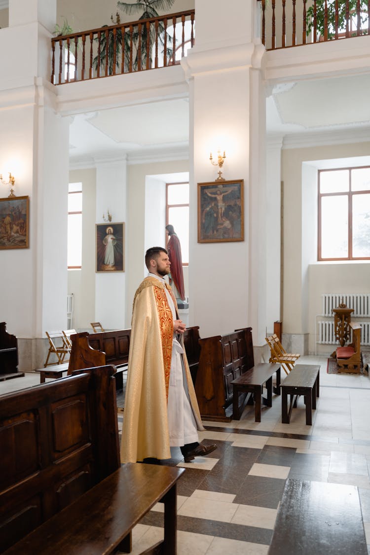 A Priest In Beige Vestment