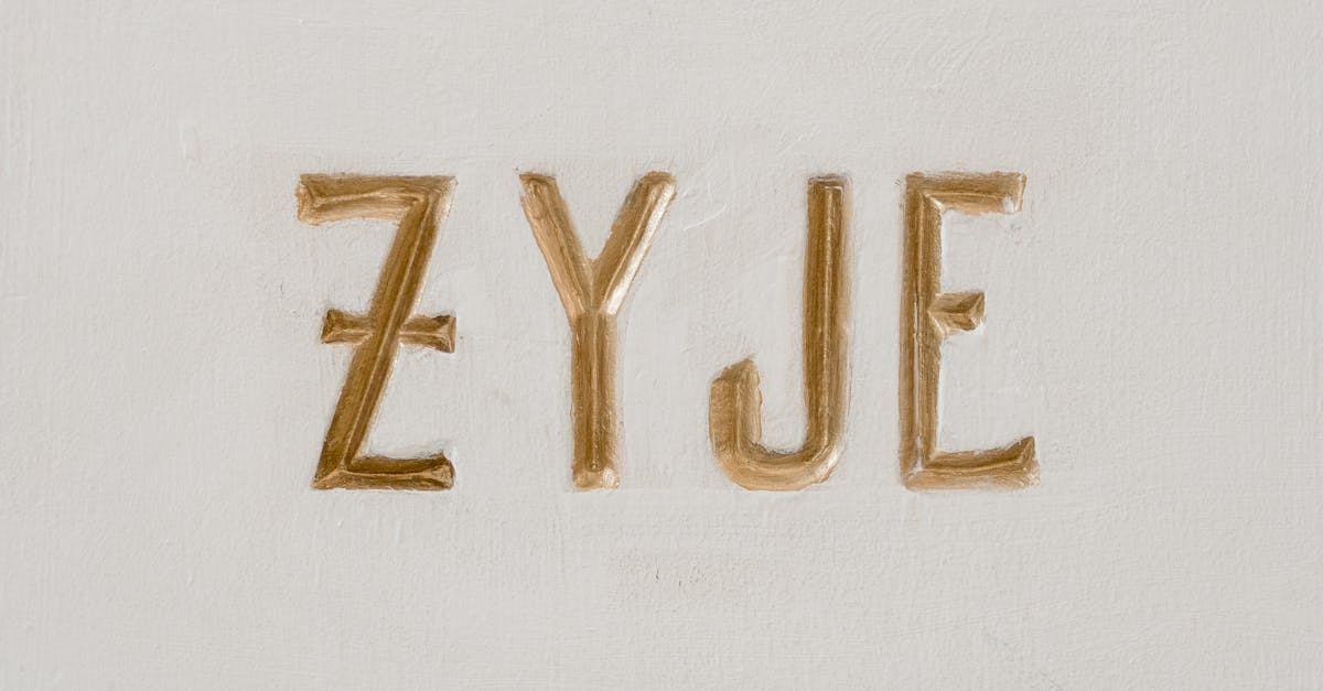 Photo by MART PRODUCTION Close-up of religious text 'Niech Zyje Jezus' on a wall.