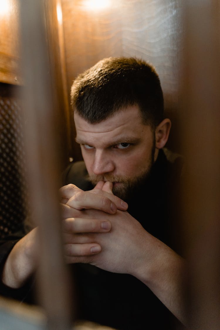 A Man Inside A Confessional