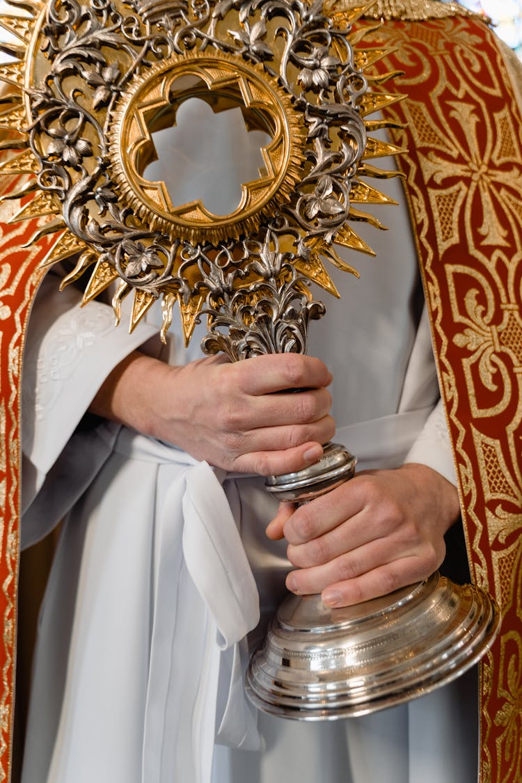 Close-Up Shot Of A Person Holding A Monstrance