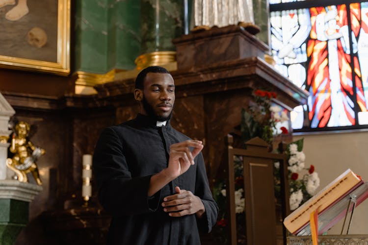 A Priest Reading From The Holy Book