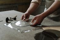 A Person Holding a Round Glass