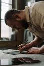 A Man Cutting a Glass