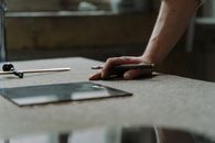 A Person Holding a Glass Cutter