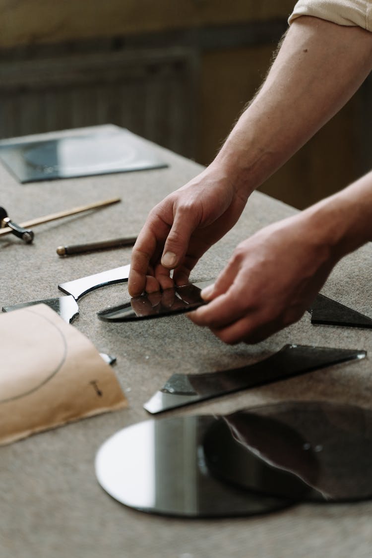 A Person Glass Cutting