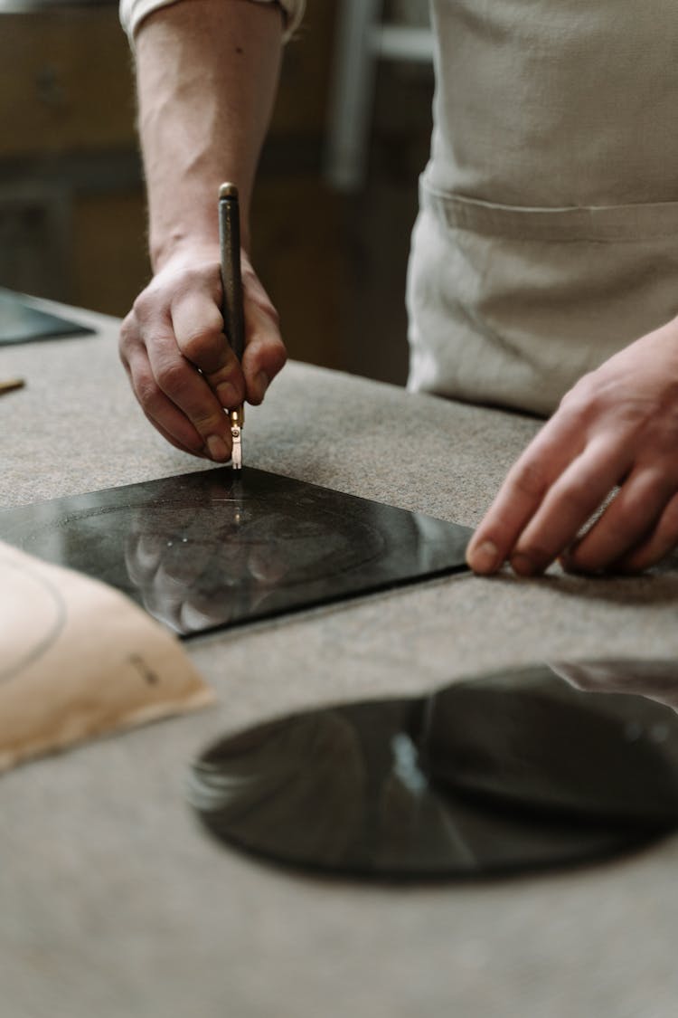 A Person Glass Cutting