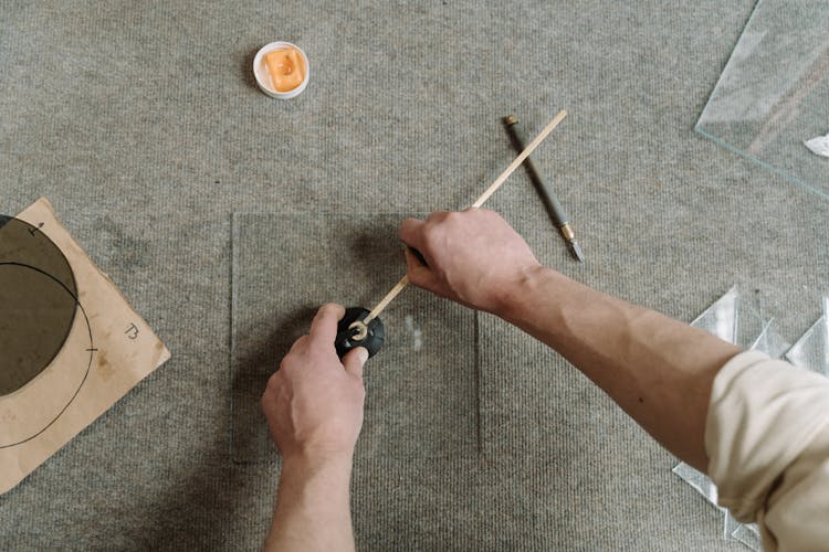 A Person Glass Cutting