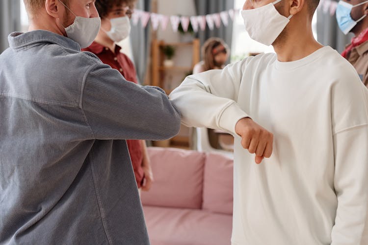 Two Men Bumping Elbows