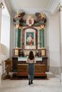 A Woman Praying inside the Church