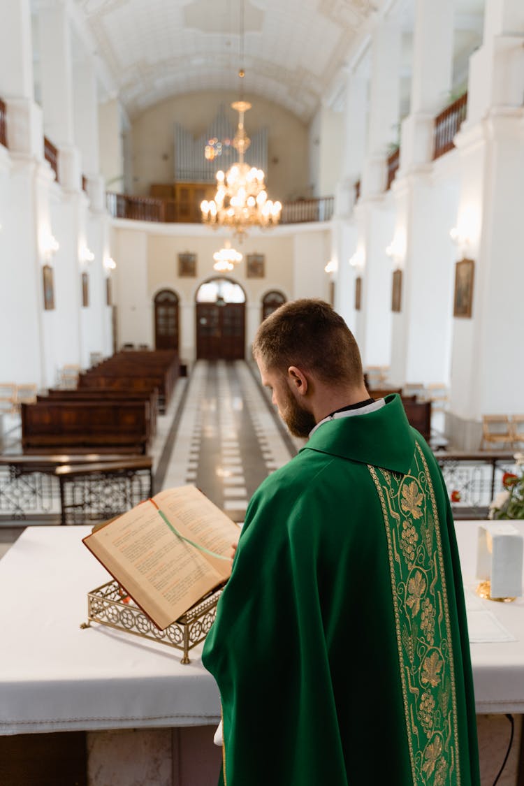 A Priest Reading A Bible