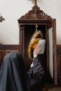 A Nun Wiping The Blessed Sacrament
