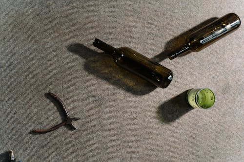Wine Glasses and Pliers on a Rug