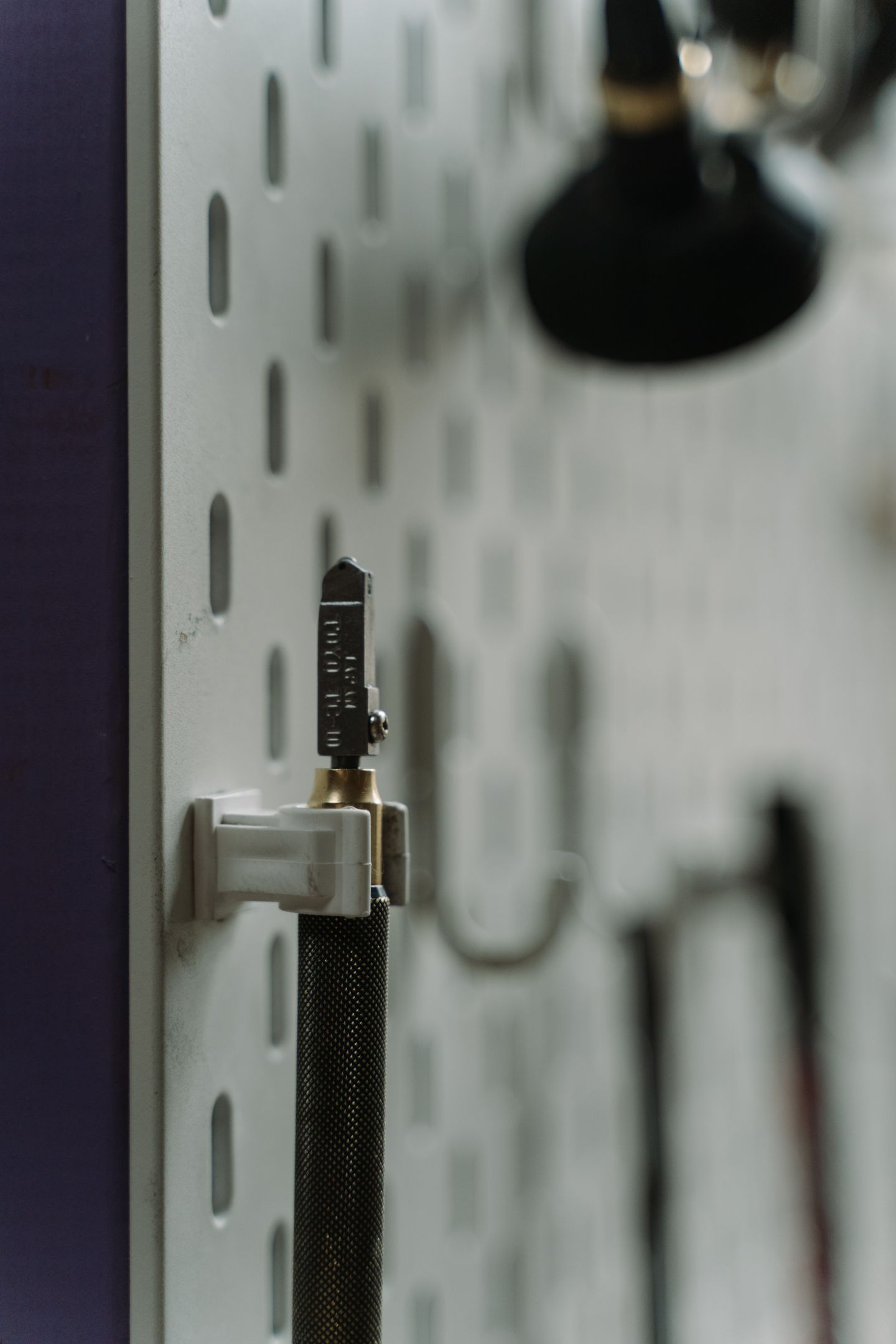 Edge profile and hardware on a glass panel.
