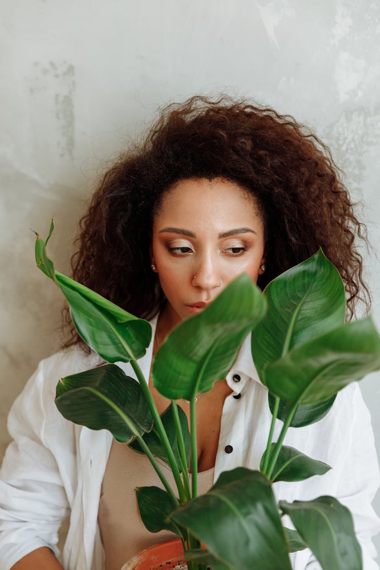 Pretty Lady Holding A Plant