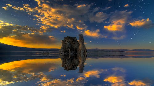 Cliff and Clouds Reflection in Water