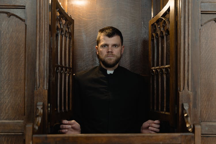 A Priest In A Confessional