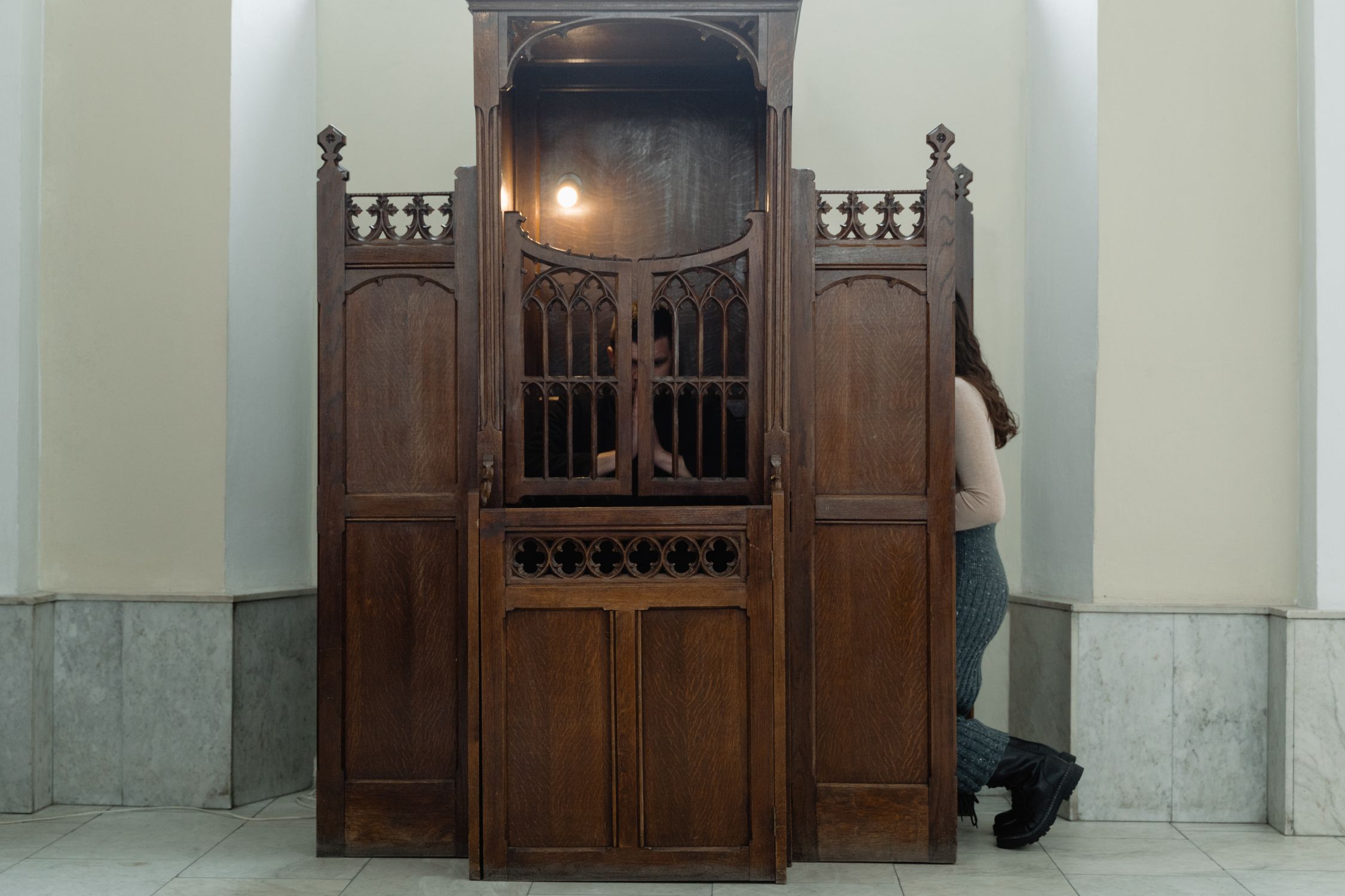 A Person Inside a Confessional · Free Stock Photo