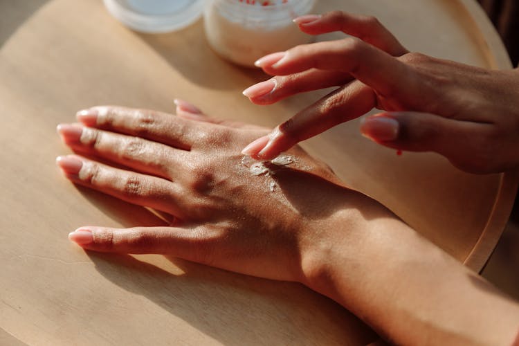 Close Up Photo Of Hands With Lotion