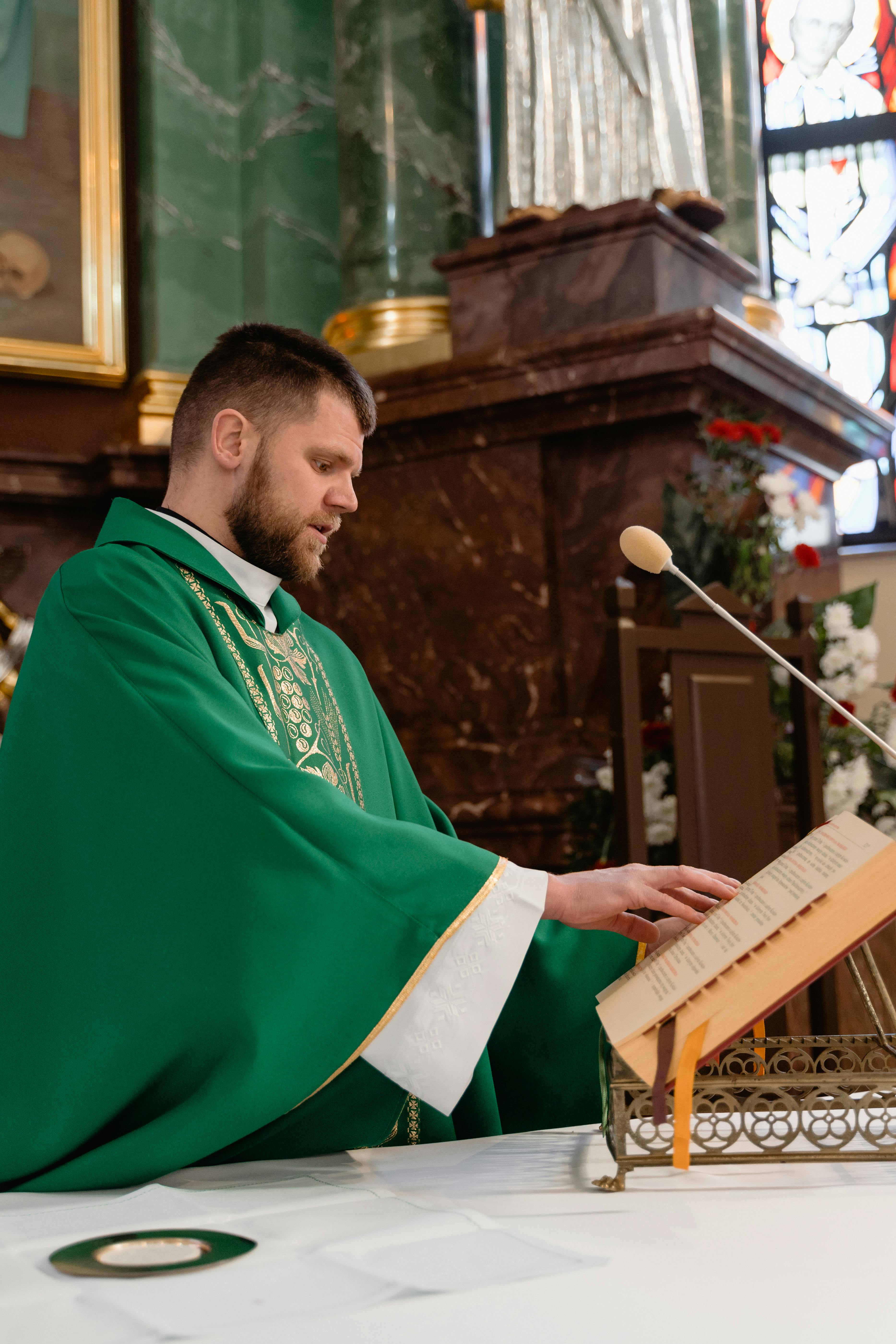 man in green robe playing piano