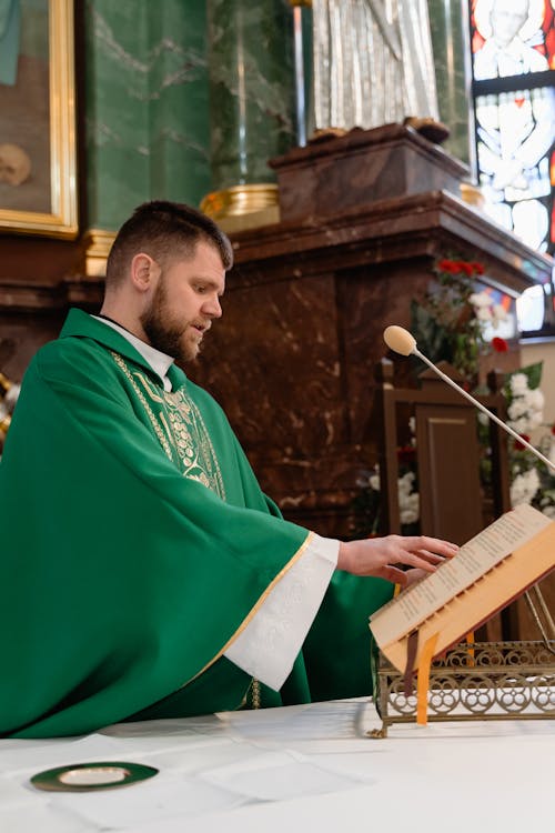 Free A Male Priest in Green Vestment Stock Photo