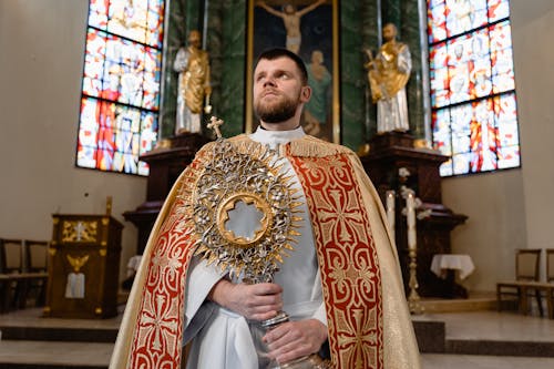 Free A Priest Holding a Monstrance Stock Photo