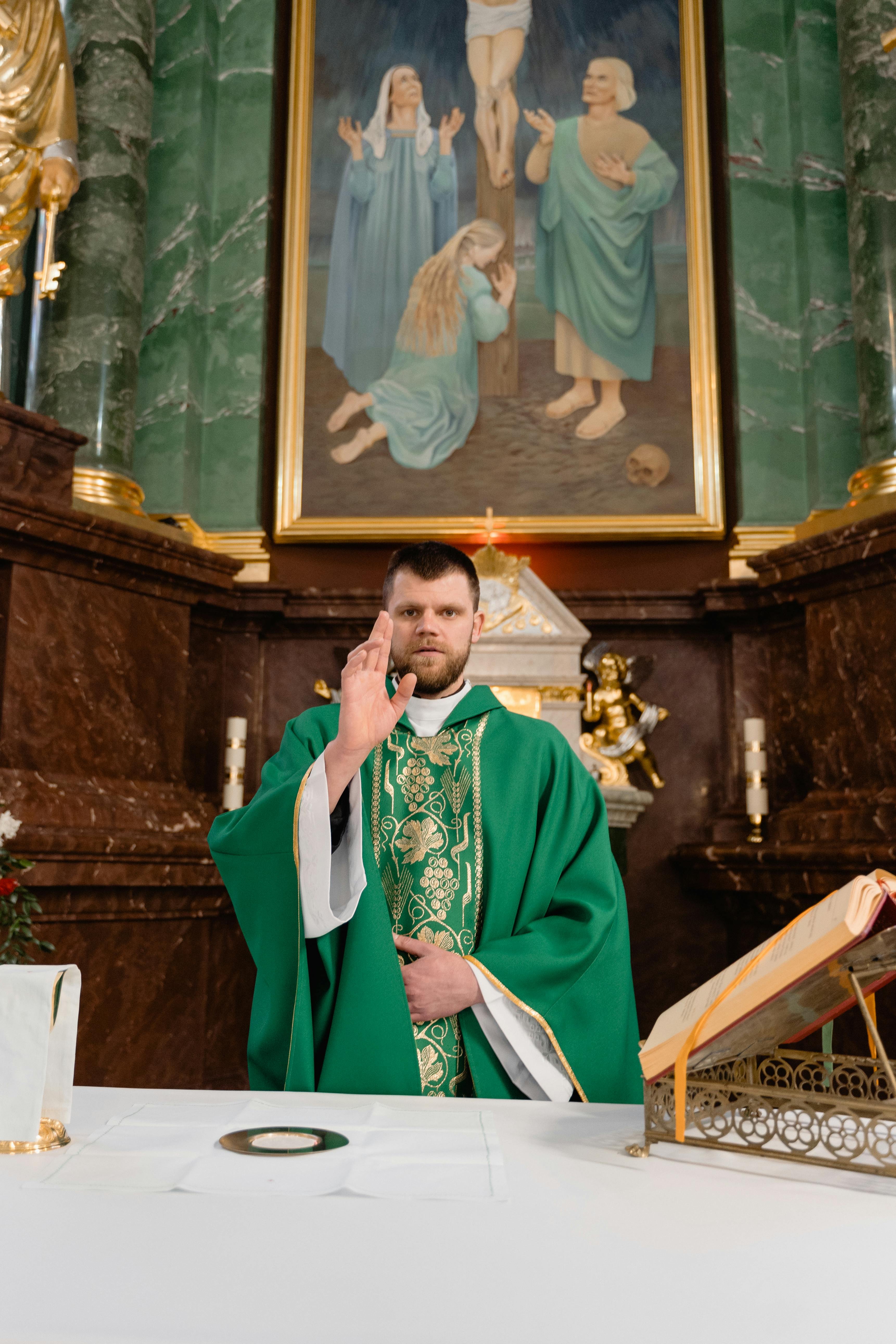 photograph of a priest near an altar