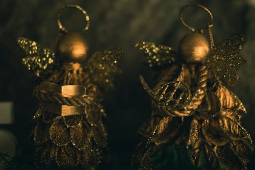 Two Gold-colored Christmas Decorations