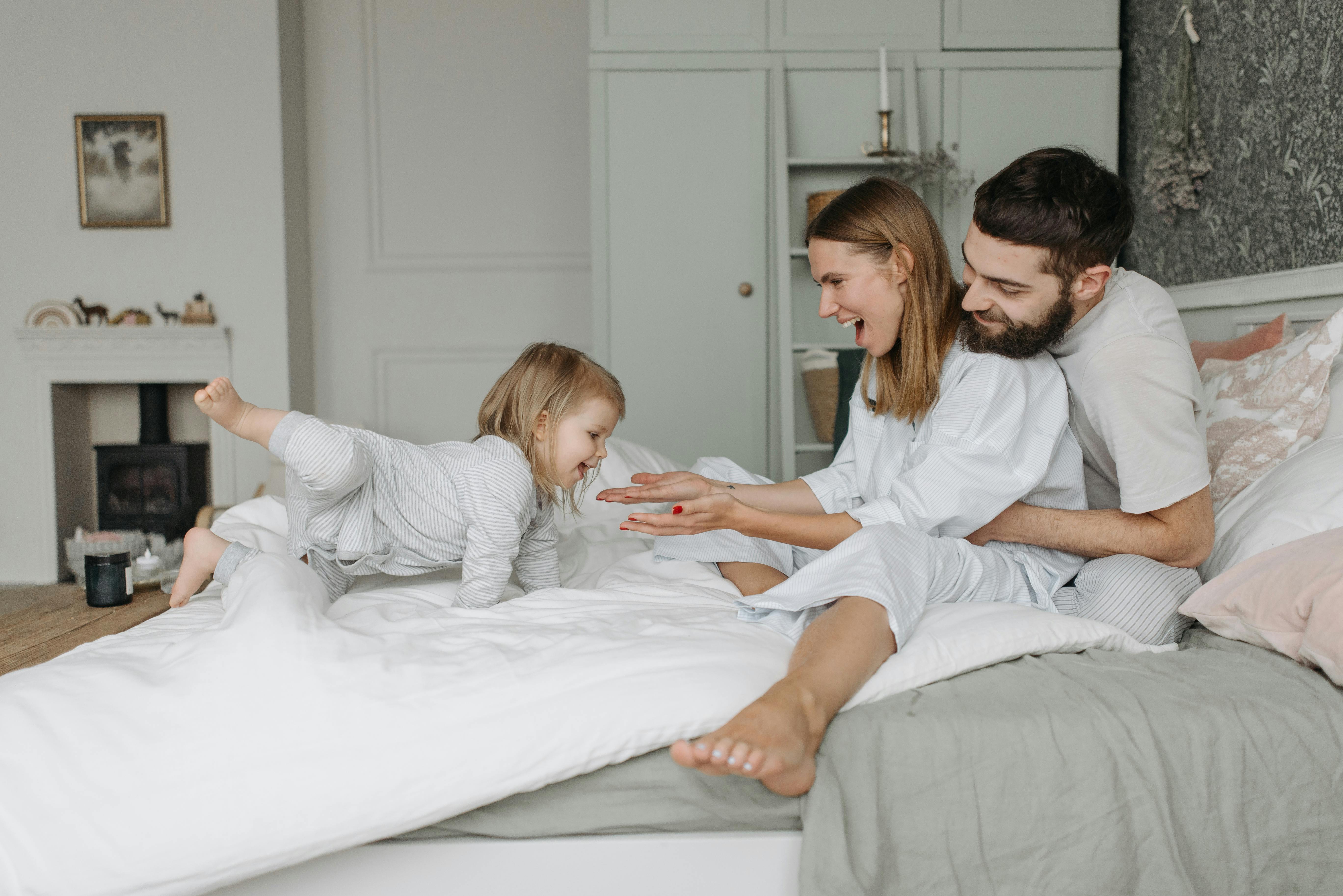 happy family on the bed