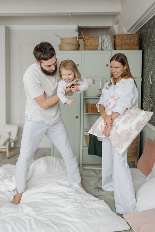 Free Happy Family on the Bed Stock Photo