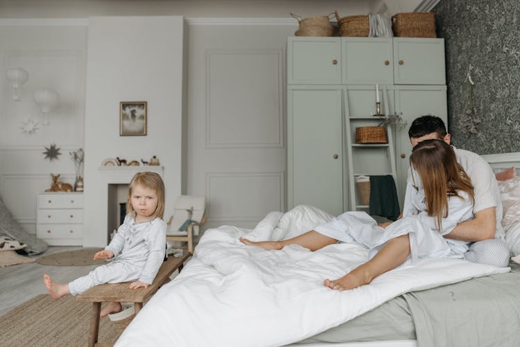 Happy Family In The Bedroom