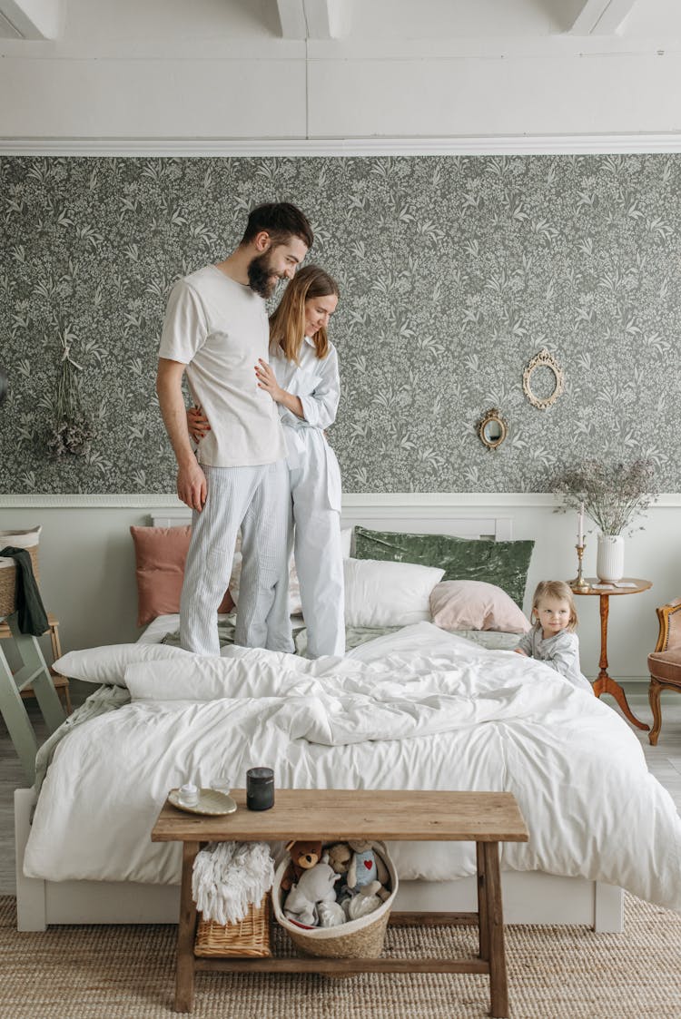 Happy Family In The Bedroom