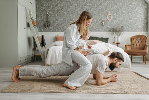 Free Family Playing in Bedroom Stock Photo