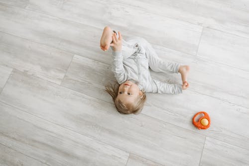 Free Cute Girl Lying on Floor Stock Photo