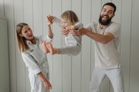 Man in White Shirt Holding Woman in White Shirt