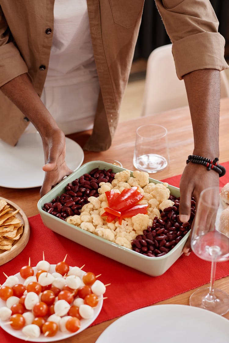 A Person Preparing Food On The Table