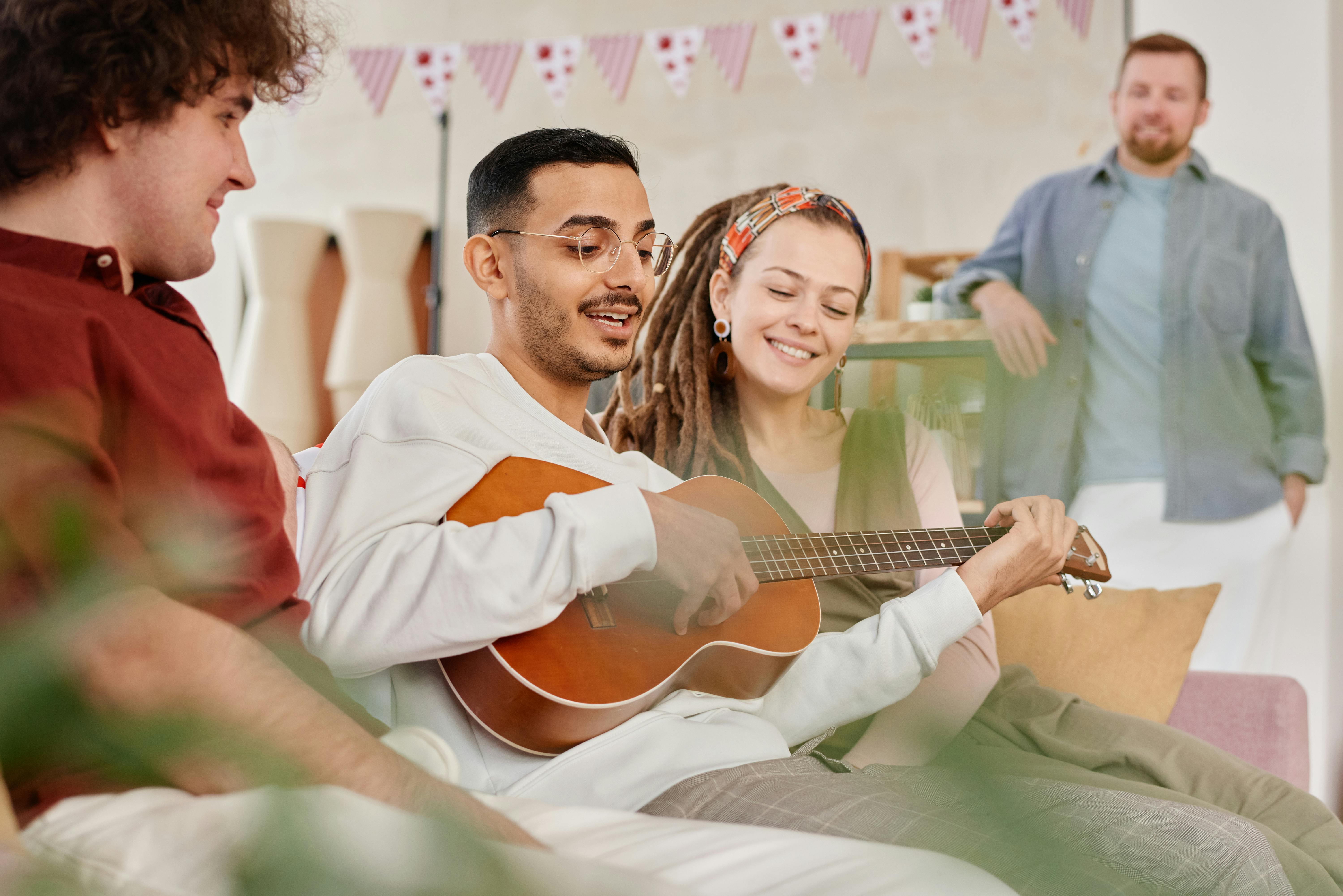 Free Man in White Dress Shirt Playing Acoustic Guitar Stock Photo