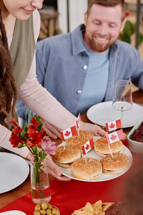 Burgers with Canadian Flags in a Plate