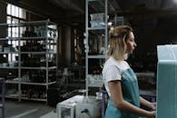 A Woman Working Inside a Workshop