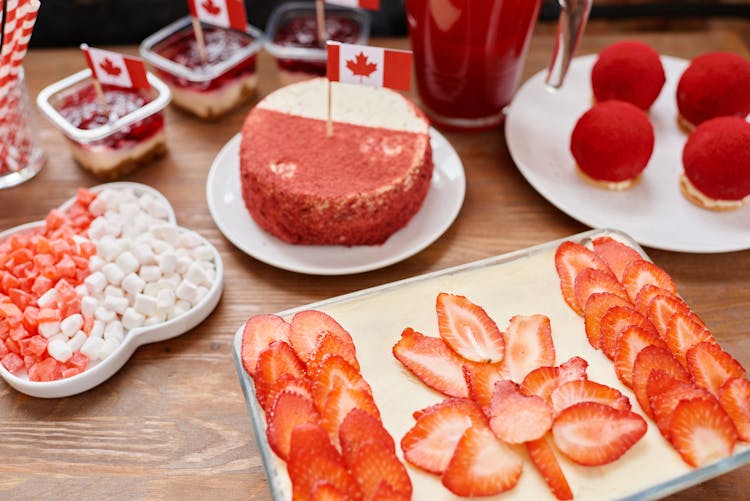 Assorted Desserts On The Wooden Table