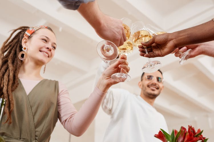 People Holding Wine Glasses Toasting 