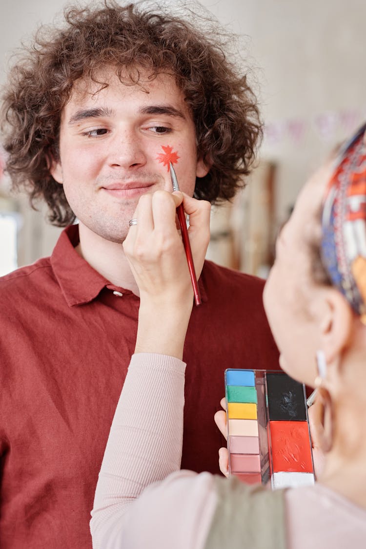 Man With Maple Leaf Painting On His Face