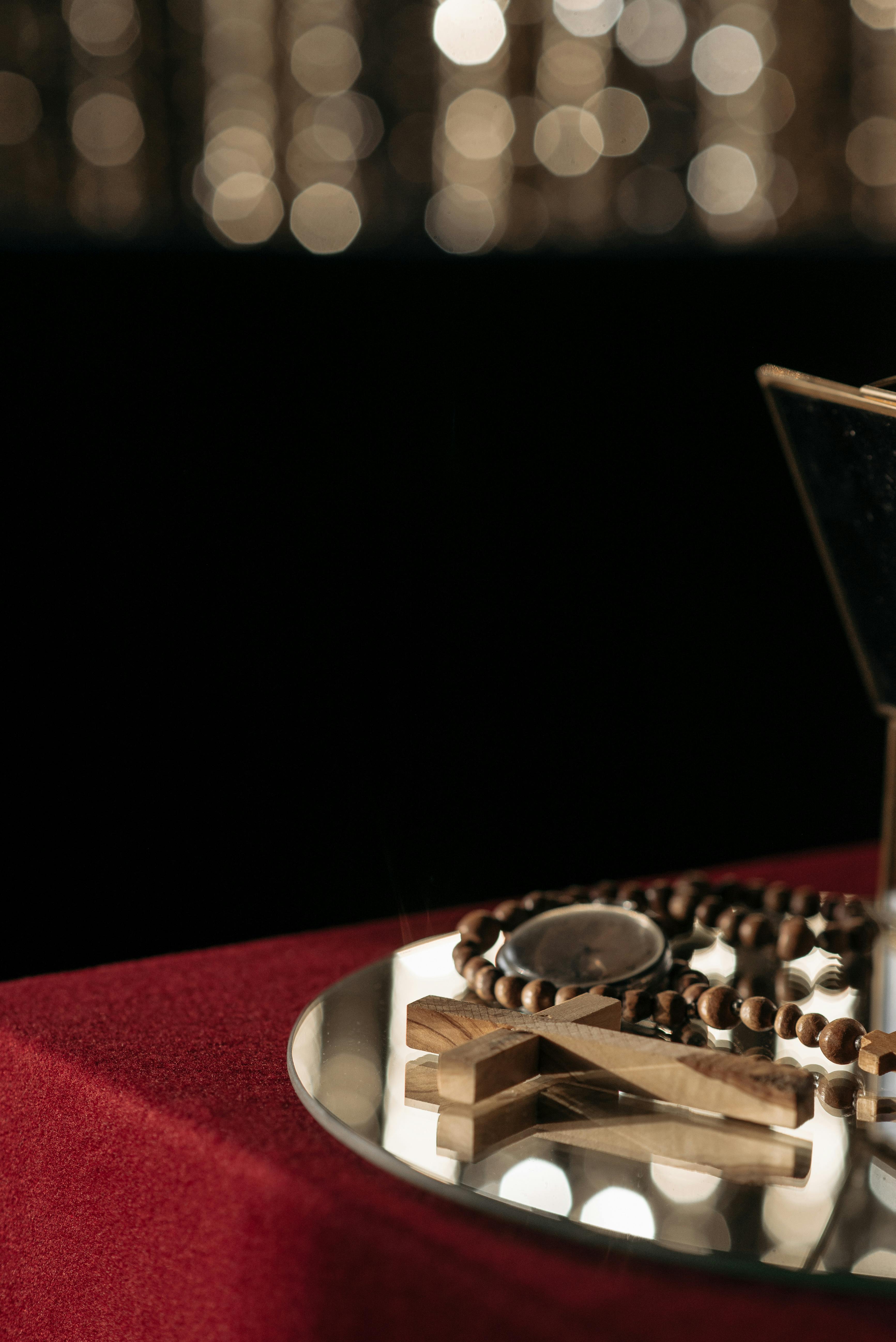 A Wooden Cross on Mirror · Free Stock Photo