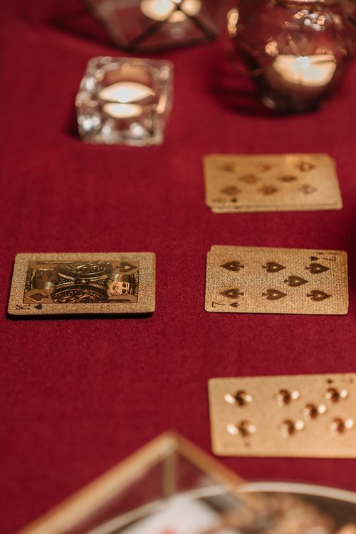 Free Tarot cards arranged on a red tablecloth with candles, evoking a mystic and fortune-telling atmosphere. Stock Photo