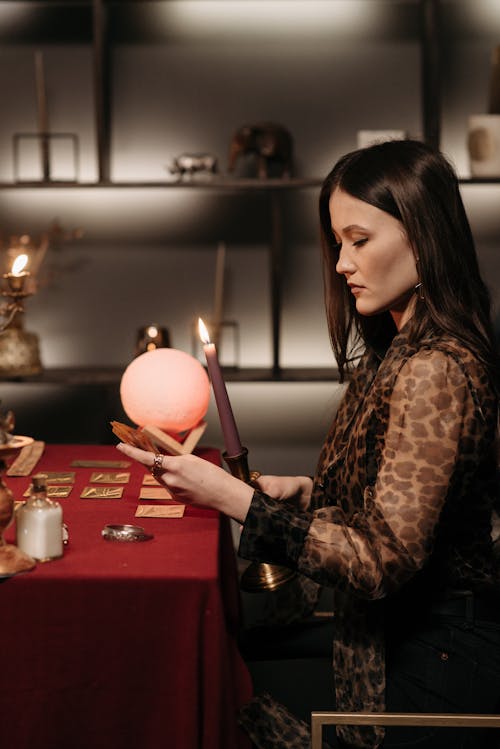 Free A Woman Holding a Crystal Ball Stock Photo